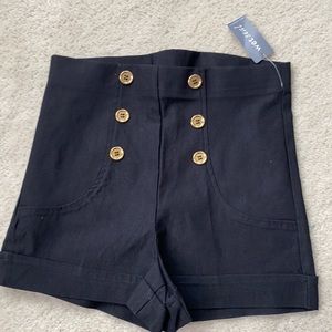 Black shorts with gold buttons